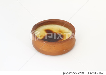 Traditional Turkish oven rice pudding in a earthenware bowl isolated on white background 132815467
