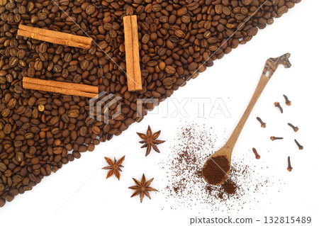 Coffee beans, cinnamon sticks, anise and wooden spoon close-up on white background Coffee beans, cinnamon sticks, anise and wooden spoon close-up on white background 132815489