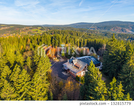 Discover the historic Slovanka Lookout Tower in the Jizera Mountains. Surrounded by vibrant autumn colors, the oldest iron tower in the Czech Republic offers stunning views and a tranquil atmosphere. Discover the historic Slovanka Lookout Tower in the Jizera Mountains. Surrounded by vibrant autumn colors, the oldest iron tower in the Czech Republic offers stunning views and a tranquil atmosphere. 132815779