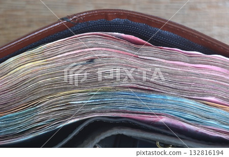 indonesia rupiah banknote in brown wallet on wooden table texture and background  132816194
