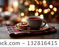 Mince pie on napkin, cup of mulled wine beside, Christmas atmosphere background 132816415