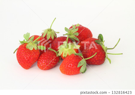 Red fresh strawberries on a white background. Green leaves of strawberries. 132816423