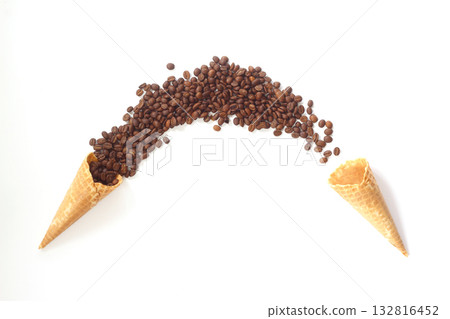 Top view of ice cream cone with coffee on the white background. Full and empty cones. Top view of ice cream cone with coffee on the white background. Full and empty cones. 132816452