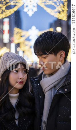 Two people walking through a cityscape with beautiful winter illuminations Two people walking through a cityscape with beautiful winter illuminations 132816647