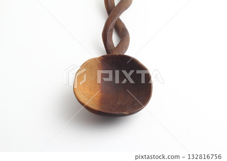 Empty spoon made of wood on white background. Top view. 132816756