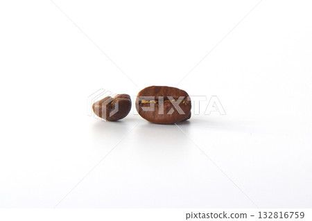grain of aromatic black coffee on a white background. Background from two coffee beans, 132816759