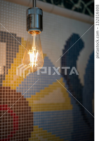LED lighting with a colorful tile wall as a background 132816808