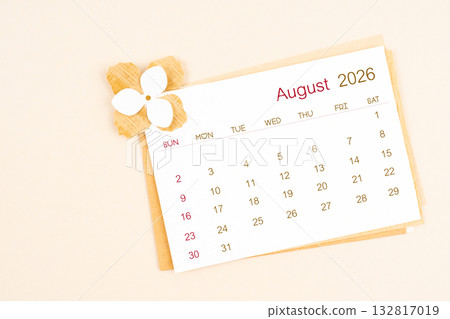 August 2026 calendar with origami flower paper on beige color background. August 2026 calendar with origami flower paper on beige color background. 132817019