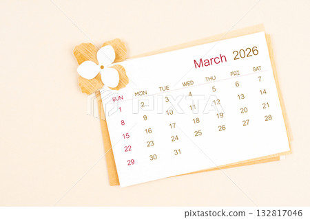 March 2026 calendar with origami flower paper on beige color background. 132817046