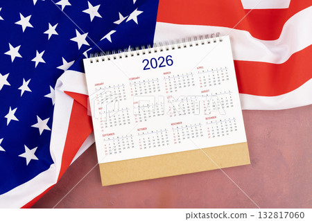 2026 Yearly desk calendar and United States of America flag. 2026 Yearly desk calendar and United States of America flag. 132817060