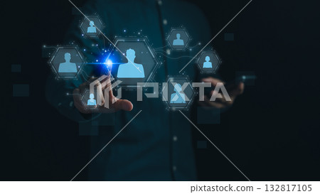 Digital networking and human connection concept. Person touchscreen interface with virtual icons of people, symbolizing social networks, online communication, HR technology and business collaboration. 132817105