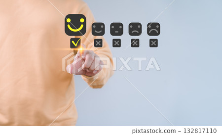 Customer satisfaction survey concept showing a happy smile face icon rating system through online application, customers evaluate product and service quality and share feedback review, testimonial. 132817110
