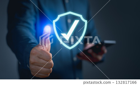 Cybersecurity with fingerprint authentication and shield check mark, symbolizing secure access, data protection, digital identity, online safety, privacy and trusted technology for business security. 132817166