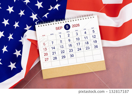 September 2026 Monthly desk calendar and United States of America flag. 132817187