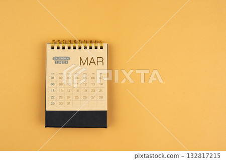 March 2026 calendar from brown craft paper on yellow color background. March 2026 calendar from brown craft paper on yellow color background. 132817215