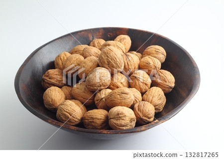Walnuts isolated on white background. Heap of walnuts isolated on white background. Walnuts isolated on white background. Heap of walnuts isolated on white background. 132817265