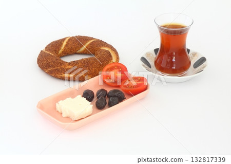 Turkish bagel, simit, tomatoes & Turkish tea on white background. 132817339