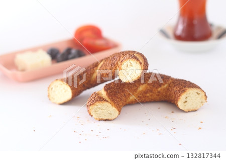 Turkish bagel, simit, tomatoes & Turkish tea on white background. 132817344