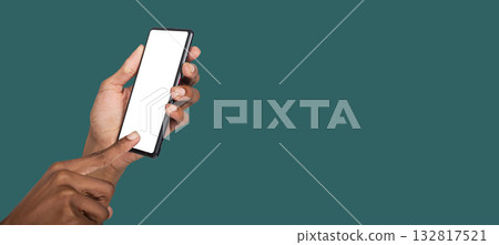 Human hand showing mockup smartphone screen for technology branding, app demo or web advertisement.. Human hand showing mockup smartphone screen for technology branding, app demo or web advertisement.. 132817521