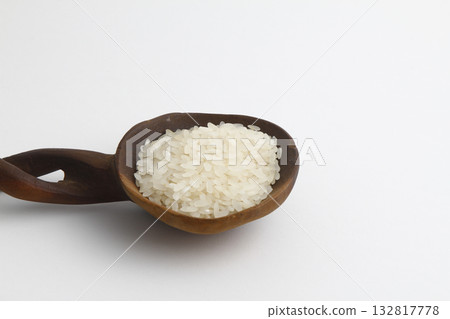 Pile lentil in wooden spoon isolated on white background. Top view. Pile lentil in wooden spoon isolated on white background. Top view. 132817778
