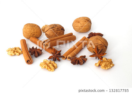 spices as cinnamon stick, anise star and walnut isolated on white background spices as cinnamon stick, anise star and walnut isolated on white background 132817785
