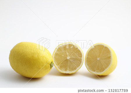 Ripe whole yellow lemon citrus fruit with lemon slice isolated on white background with clipping path. 132817789
