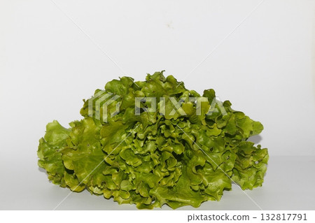 Bunch of fresh, green batavia lettuce salad head top view isolated on white background with copy space. Bunch of fresh, green batavia lettuce salad head top view isolated on white background with copy space. 132817791