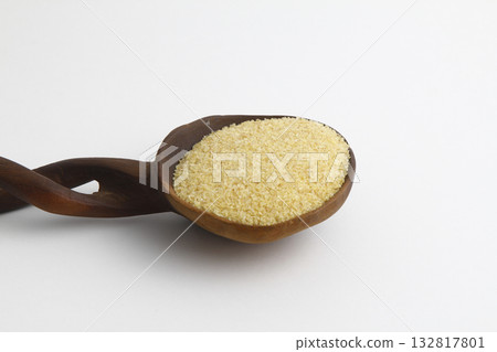 dry bulgur wheat in wooden spoon isolated on white background. top view 132817801