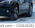 Image of studless tires on a car running on a snowy road Asahikawa City, Hokkaido 132818282