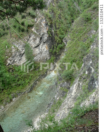 The mountain paradise of Arshan: turbulent waters rush among high, grass-covered cliffs 132818411