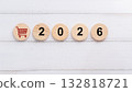 Red Shopping Cart Icon with Wooden Round Discs Displaying the Year 2026 132818721