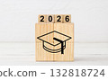 Black Graduation Cap Icon on Wooden Blocks with 2026 Year Display 132818724