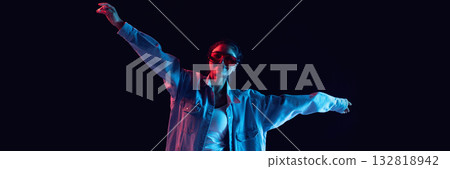 Woman smiling wearing oversized red glasses posing with confidence under neon glow. Banner Woman smiling wearing oversized red glasses posing with confidence under neon glow. Banner 132818942