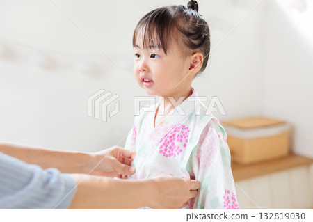 A 2-year-old girl wearing a yukata. Children's yukata dressing A 2-year-old girl wearing a yukata. Children's yukata dressing 132819030