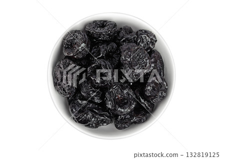 Prunes in ceramic bowl isolated on white background, heap of dried plums. Top view. Flat lay 132819125