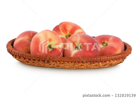chinese flat donut peaches in a wicker basket isolated on white background 132819139