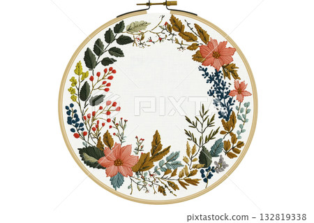 A circular embroidery hoop featuring a floral wreath design with colorful leaves and flowers on a light background. 132819338