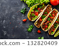 Mexican tacos with beef, vegetables and salsa. Tacos al pastor on wooden board on black background. Top view with copy space 132820409
