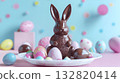 Chocolate bunny figure surrounded by colorful Easter eggs on a pastel pink surface, creating a festive and joyful atmosphere for holiday celebrations and decorations 132820414