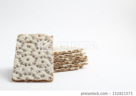 Isolated rye, wheat crisp bread on a white background. 132821571
