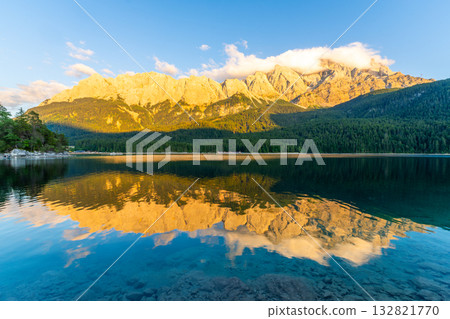 Eibsee Lake and Zugspitze Massif at Sunset. Reflection on Water. Bavaria, Germany Eibsee Lake and Zugspitze Massif at Sunset. Reflection on Water. Bavaria, Germany 132821770