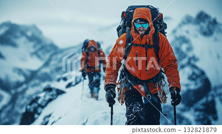 Two climbers are climbing up a snow-covered mountain slope. They are using trekking poles and carrying backpacks. The weather is harsh and snowy, but the climbers are focused on their journey. Two climbers are climbing up a snow-covered mountain slope. They are using trekking poles and carrying backpacks. The weather is harsh and snowy, but the climbers are focused on their journey. 132821879
