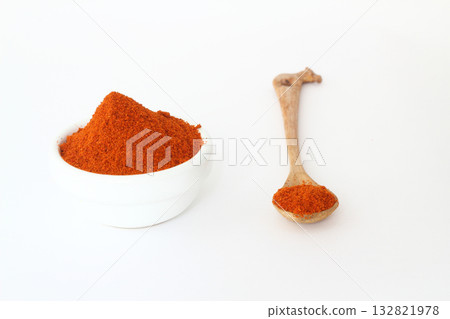 red dried crushed hot chili peppers and chili flakes or powder isolated on white background red dried crushed hot chili peppers and chili flakes or powder isolated on white background 132821978
