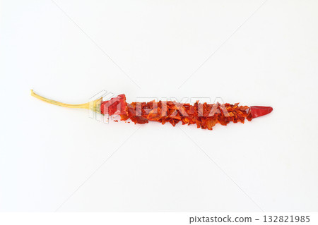 red dried crushed hot chili peppers and chili flakes or powder isolated on white background 132821985
