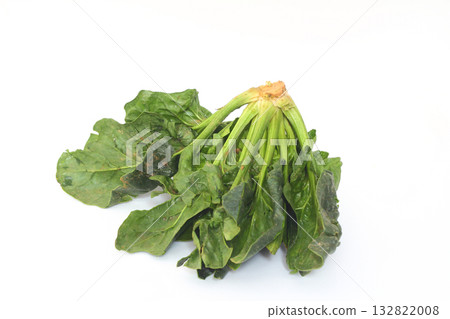Spinach leaves isolated on white background. Fresh green spinach heap Top view. Flat lay. Spinach leaves isolated on white background. Fresh green spinach heap Top view. Flat lay. 132822008