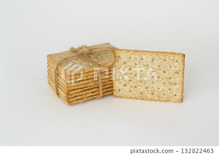 Pile of crackers with different seeds isolated on white background. Pile of crackers with different seeds isolated on white background. 132822463