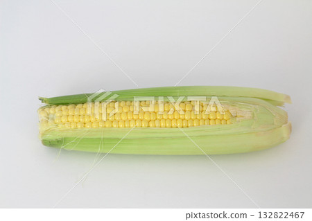 Raw corn on a white the background 132822467