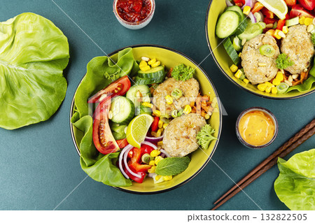 Fried cutlets in buddha bowl, fish patties. 132822505