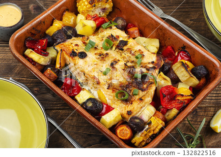A delicious piece of salmon fried with vegetables. A delicious piece of salmon fried with vegetables. 132822516