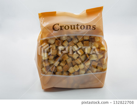 Bag of crunchy croutons closeup on white background. 132822708